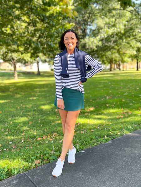 Fall activewear outfit. Love switching to navy and green for the fall! Paired similar skorts and the exact navy long sleeve striped top. It fits TTS with a loose fit, wearing a small. Paired with my favorite white tennis shoes.

Stripes, casual look, ootd, mom style, activewear, preppy, classic #classicstyle #preppy #activewear #momstyle #fallfashion 

#LTKunder100 #LTKSeasonal #LTKstyletip