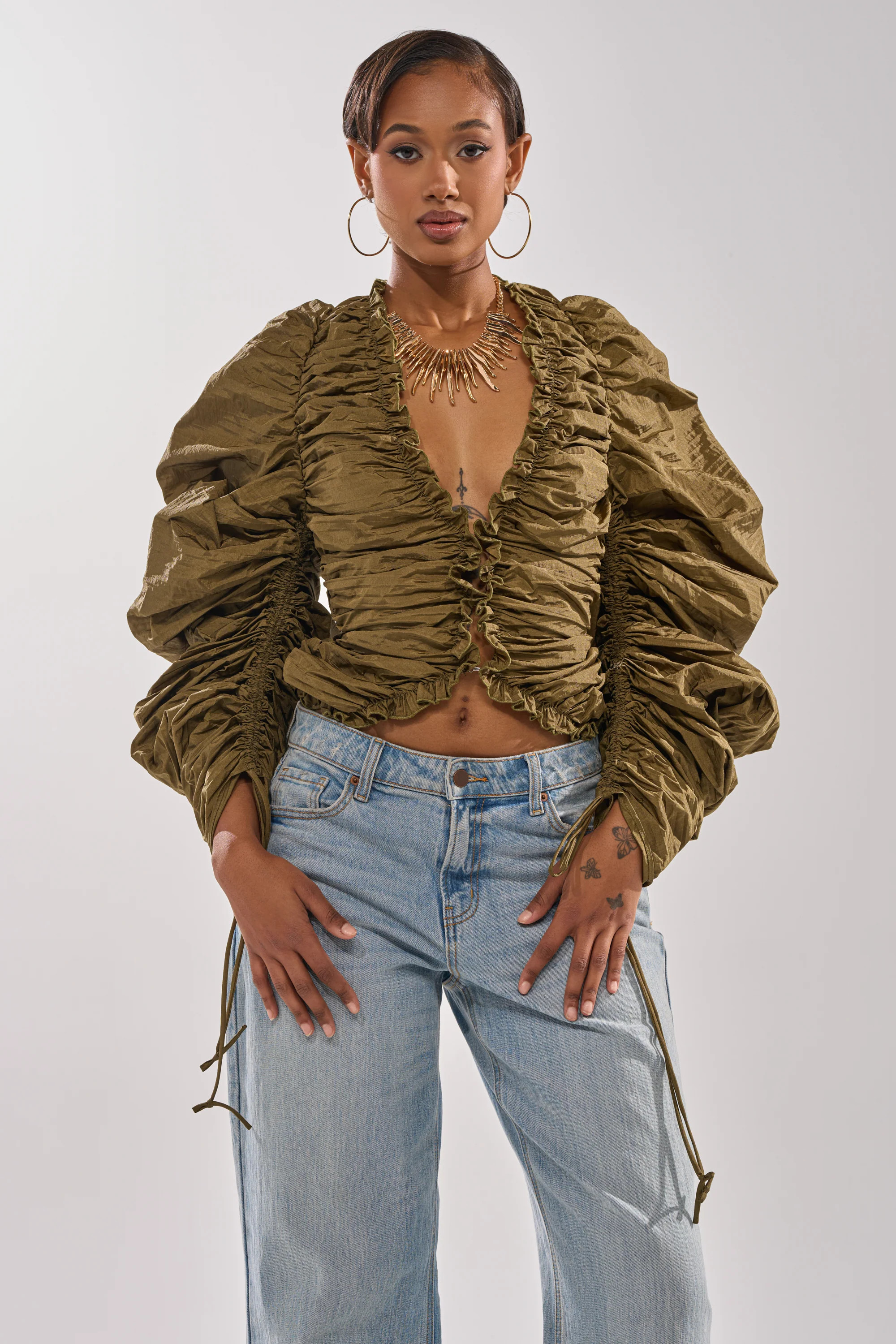 IN IT TO WIN IT RUCHED BLOUSE | AKIRA