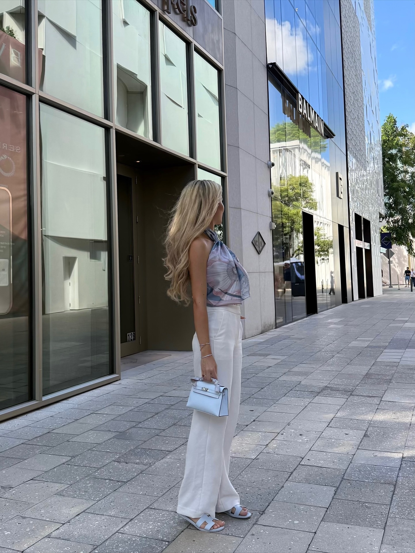 Wearing my favorite everyday white pants. They are in a light crepette fabric that is easy to maintain, only slightly see through. Elevates any outfit with the beautiful subtle structure. Wearing a size 2. Always excited to take out miss Blue Brume - and I love how the Santorini sandals in blue glacier somehow still matches perfectly ✨ #chicfashion #scarftop #hermessilkscarf #hermesbluebrume

#LTKStyleTip #LTKWorkwear