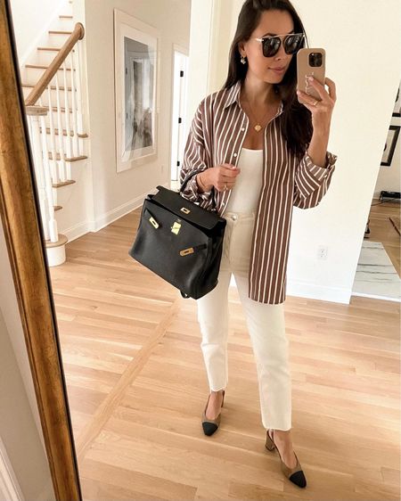 Kat Jamieson of With Love From Kat wears a stripe button down shirt, cream bone colored denim jeans, slingbacks, and an Hermes Kelly bag. Everyday outfit, casual style, fall. 

#LTKSeasonal #LTKitbag #LTKworkwear