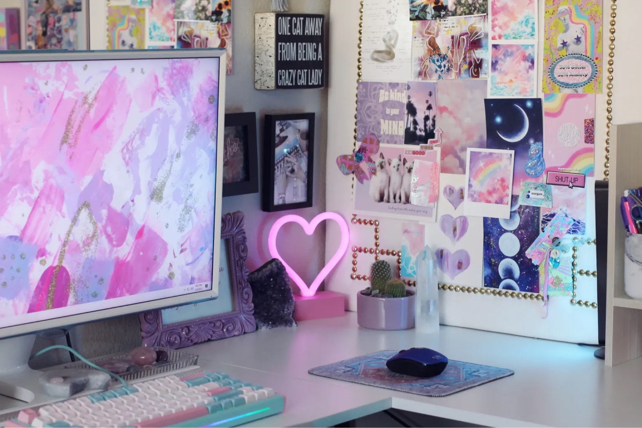 Corner of my office - my ‘creative corner’ for doing arts and crafts. Inspiring vision board and art hung everywhere. Neon heart light, crystals, and art prints  

#LTKHome