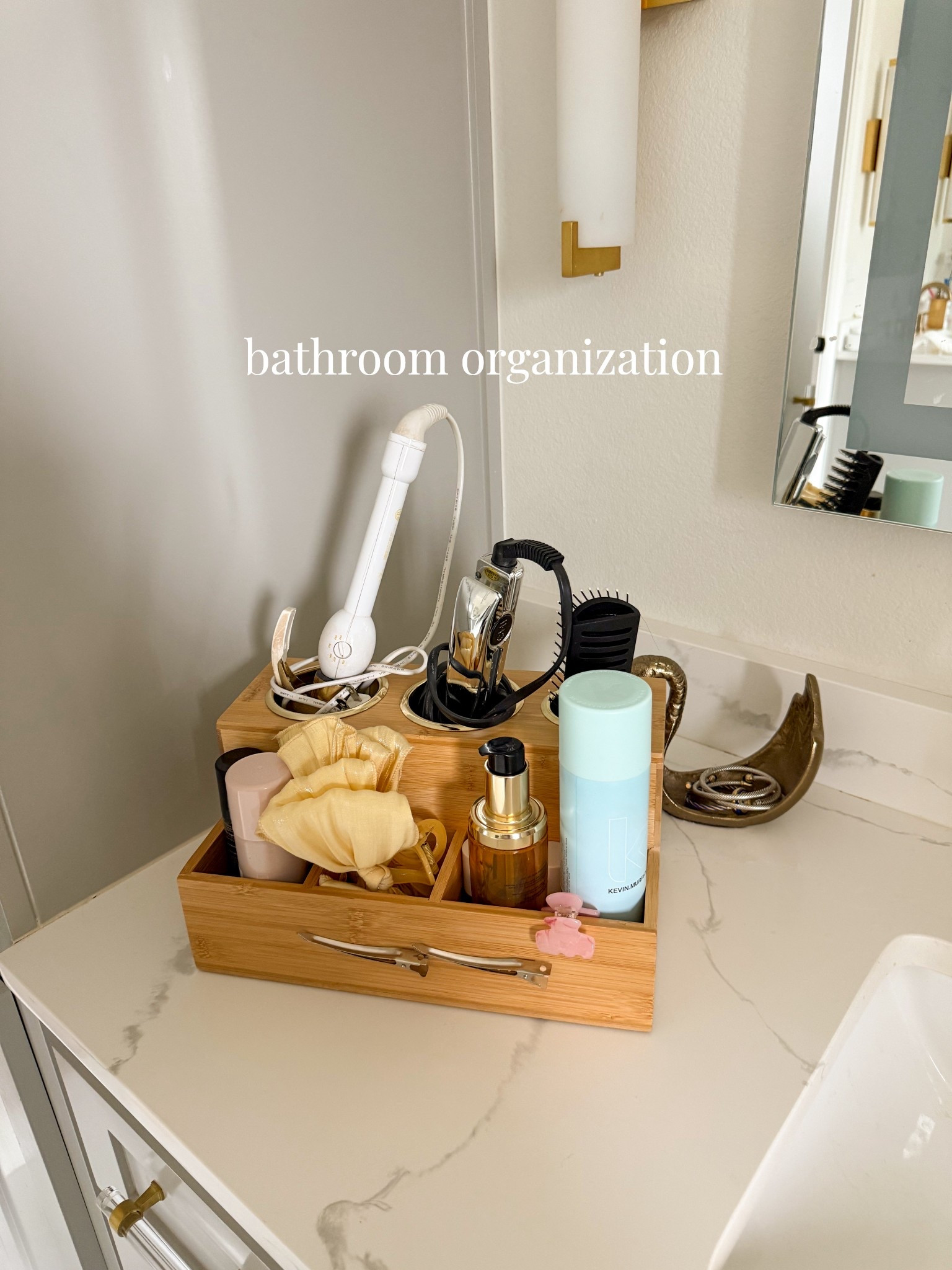 Bathroom organization for hair tools and accessories! The top cubbies are lined to help protect hot tools from touching anything else. I love that the front is magnetic so you can toss bobby pins and accessories that often get lost in drawers to it! 

home organization, bathroom organization, hair accessories, vanity organization, self care, routine   

#LTKBeauty #LTKHome
