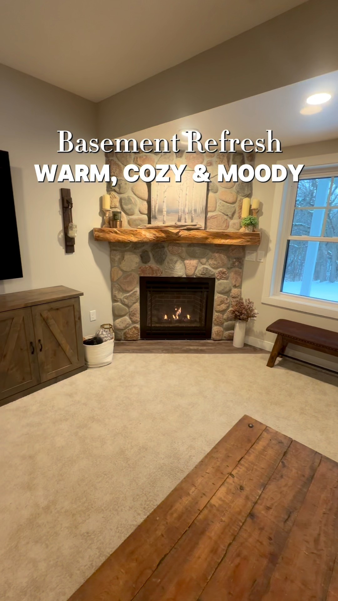 Basement refresh 🤎
Our lower level has such a different vibe than the main floor—warmer, cozier, and a little moodier with the natural stone, wood tones, and warm neutral walls.

I’ve honestly never shown this space before because it was minimally decorated… but I’m finally adding a few simple cozy touches to make it feel elevated while still relaxed and welcoming.

The bar area is my favorite detail ✨ the natural stone wall with shelves + backlighting, black granite counters with golden flecks, our handmade whiskey barrel table, and the sweetest finishing touch—the US flag art my son made 🇺🇸🤍

It’s also the perfect spot for entertaining—abundant seating, the bar area, and plenty of room for games (poker, shuffleboard, ping pong… you name it). We love having family gatherings down here 🫶 

#LTKHome