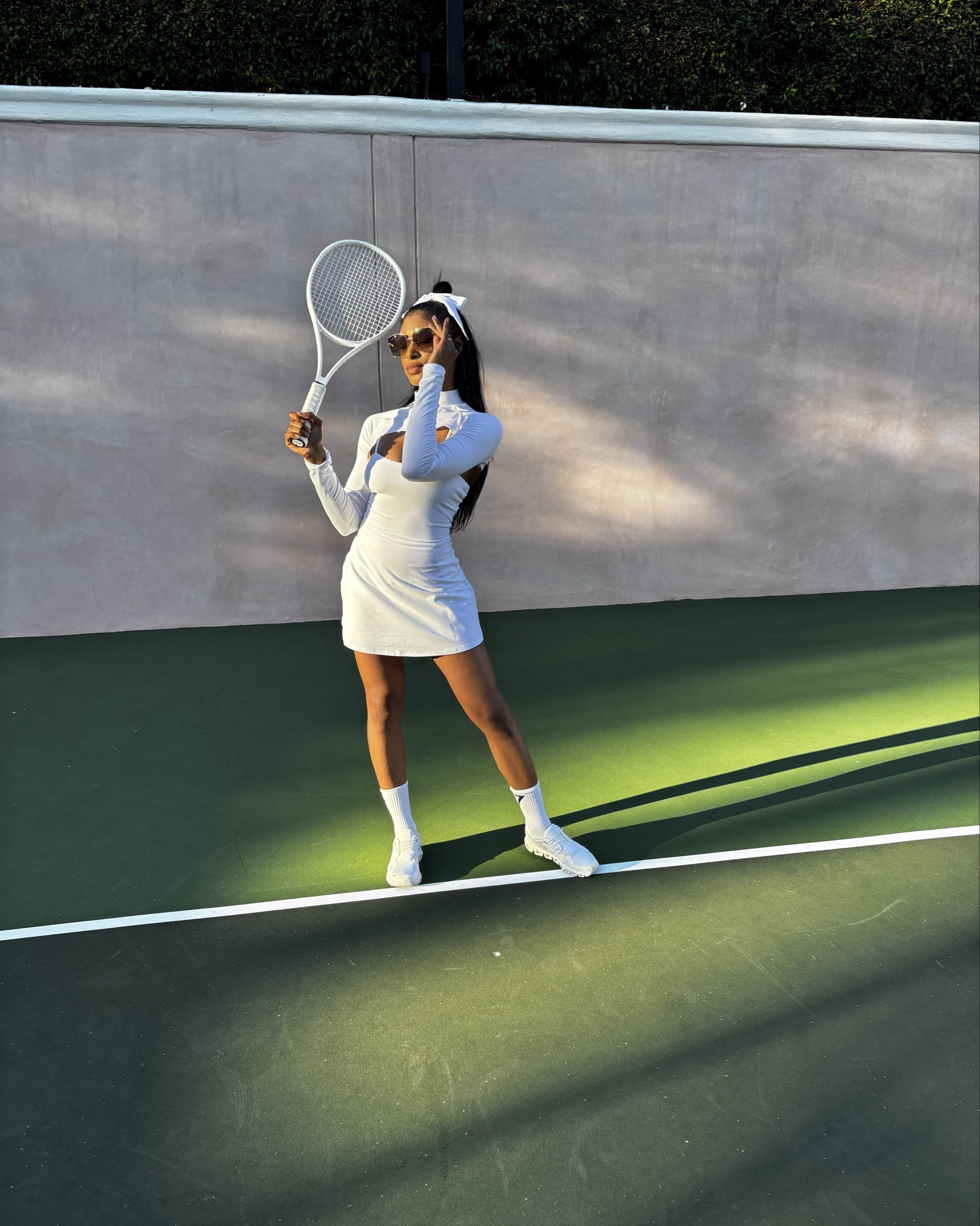 Serving looks on and off the court in this ultra-chic all white tennis inspired fit. This long-sleeve top over the  dress brings sporty sophistication with a bold cut out detail and sleek, sculpting fabric that hugs in all the right places. Paired it with classic white sneakers, high socks, oversized sunnies, and a statement bow for that playful, feminine finish. 🤍

Perfect for: tennis dates, summer brunch, or just feeling like the main character

#LTKWorkwear #LTKActive #LTKStyleTip