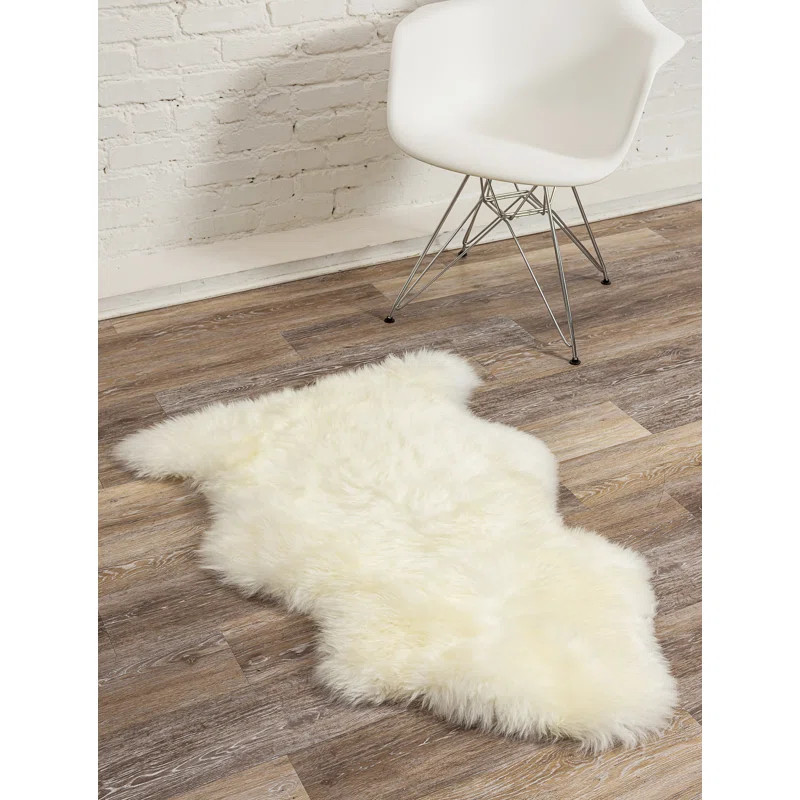 Novelty Juri Solid Color Handmade Sheepskin 2' x 3' Area Rug in Ivory | Wayfair North America