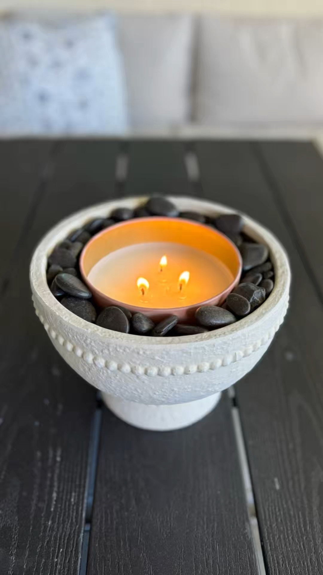 The EASIEST patio craft! 

You’re going to need one of these planters from Walmart, a Centinella candle, a couple bags of craft white sand, and a couple bags of black decorative rock.￼

I love this so much and it’s so affordable and chic. 

Walmart, Walmart finds, dollar tree 

#LTKmomlife #LTKHome #LTKSeasonal