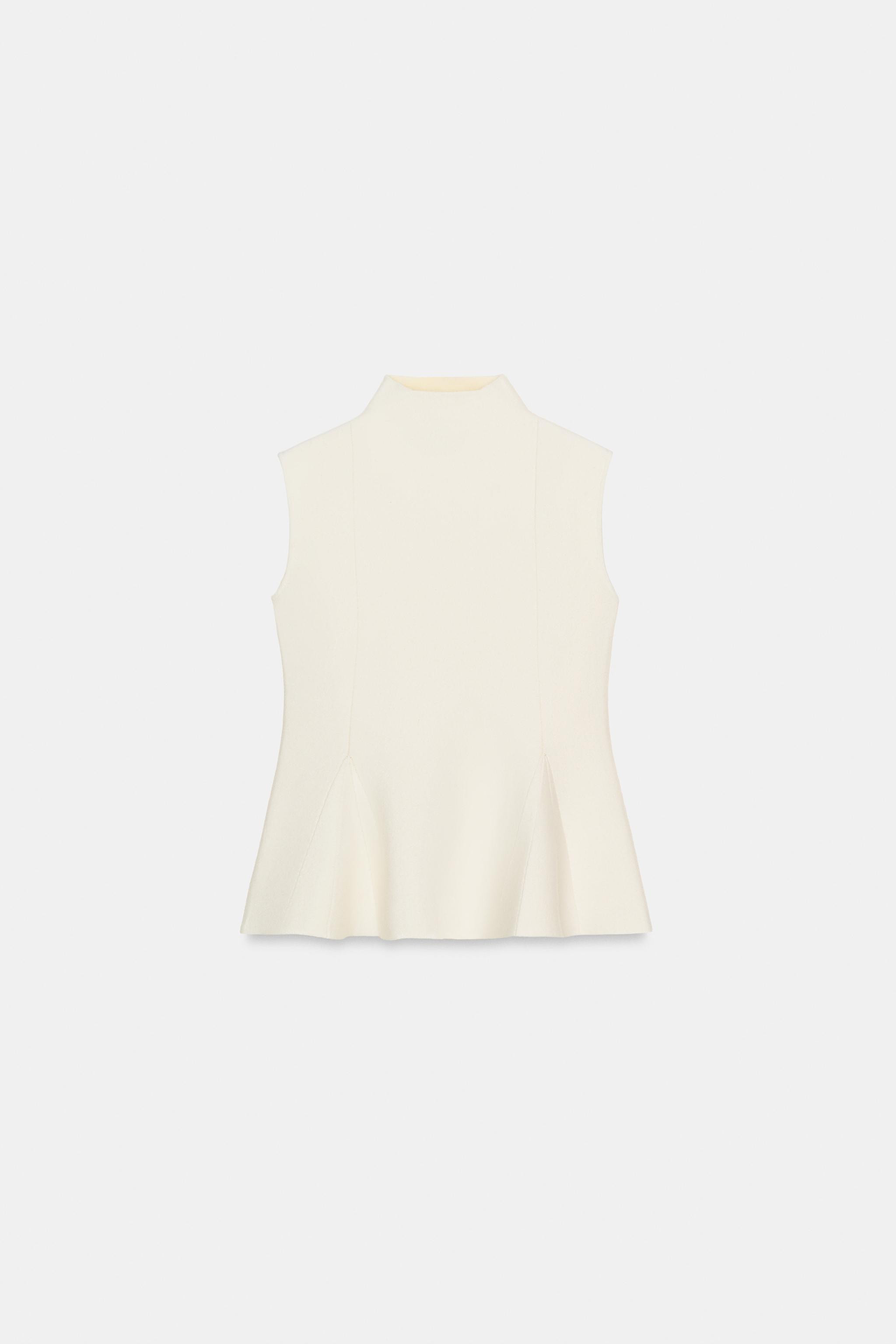 High neck and sleeveless top. Flared hem. | Zara US