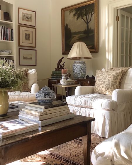 All about the Nancy Meyers cozy living room. A great slipcover chair, vintage art, & ginger jar lamp are staple elements  

#LTKhome #LTKfamily #LTKfindsunder100