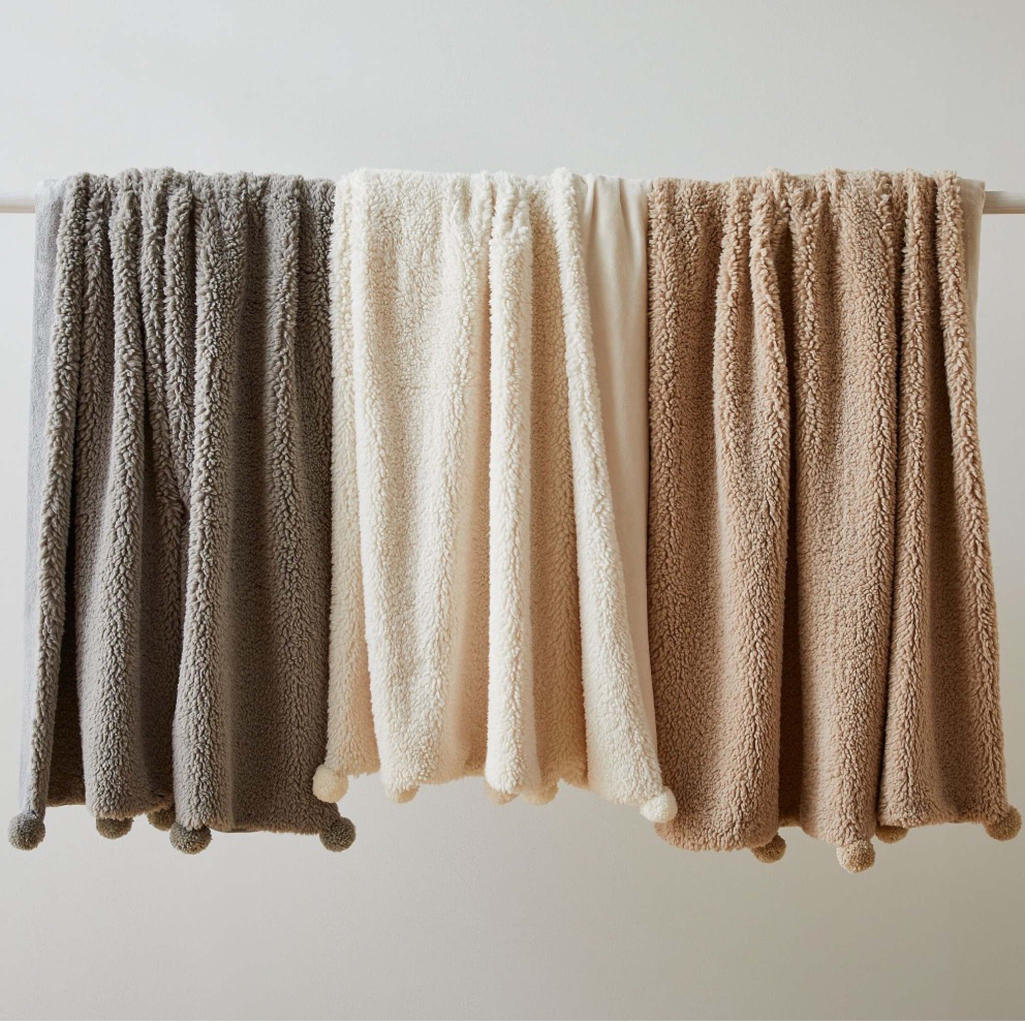 60% off West Elm blankets sherpa boucle with pom moms in 3 color options. Only $25!! Decorative cozy throw blanket tan cocoa brown, cream white, or charcoal gray color. Great gift idea. Stock up while on sale! Free shipping. Dupe dupes more affordable option find replica copy cat similar look for less budget friendly affordable cheap cheaper beautiful pretty. Love dupes like these? I share multiple every day in my Facebook group “DAILY DECOR DUPES”

#LTKU #LTKhome #LTKunder50