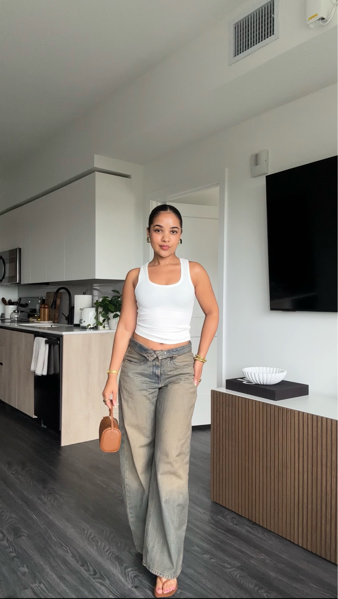 wearing size 0 in the jeans and the tank is from thirty years