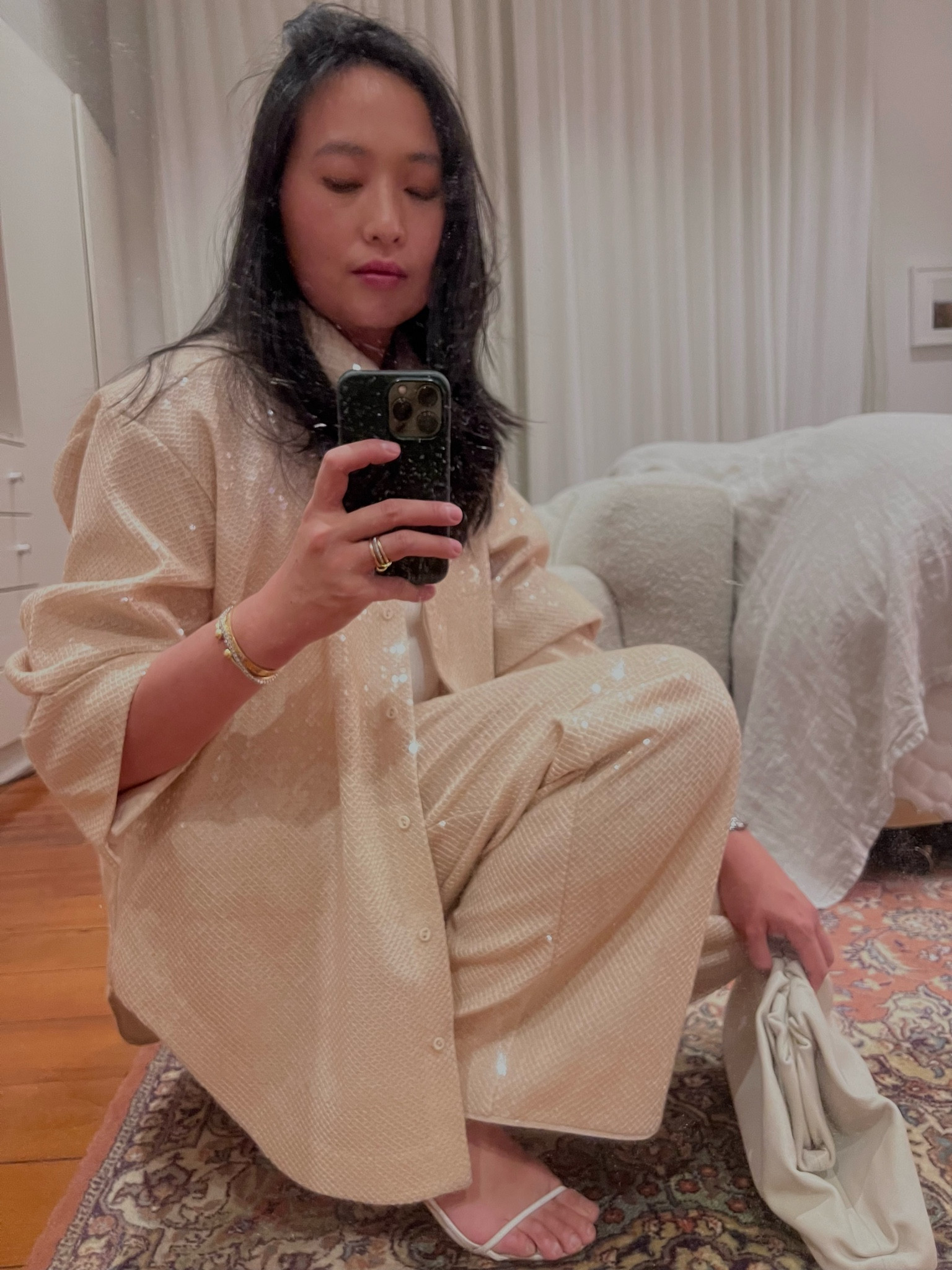 Size down in the top. Pants are TTS or size up for a more relaxed look (I did.)