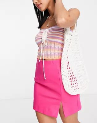 Stradivarius mini skirt with split hem in pink | ASOS (Global)