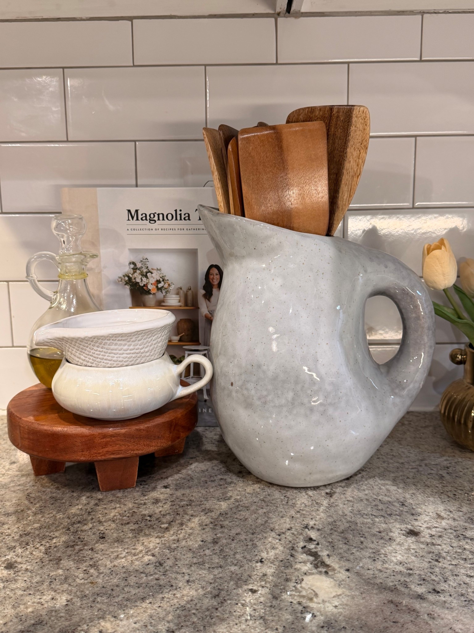 Countertop Essentials. Utensils holder, pitcher, wooden cooking utensils, ceramic mug, and oil jar.

#LTKHome