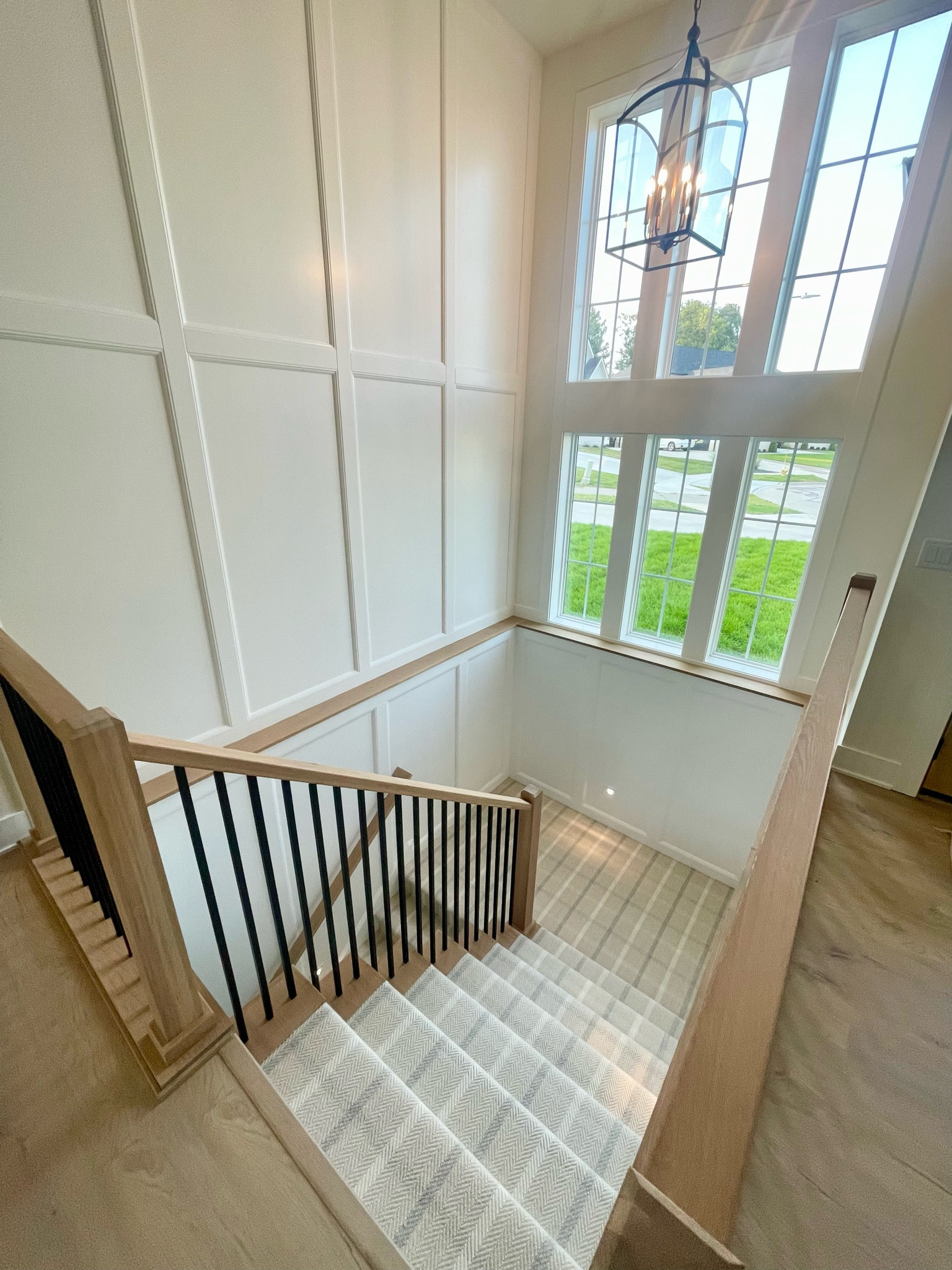 Paint Color: Chantilly Lace
Carpet Stair Runner: Tattersall Carpet from Stanton
Perigold Light Fixture Lanternn

Custom Home Build // Husk Homes // Custom Built home in Iowa // Stairway entryway light fixture // Light fixture lantern // Home decor // new home build selections // 

#LTKHome