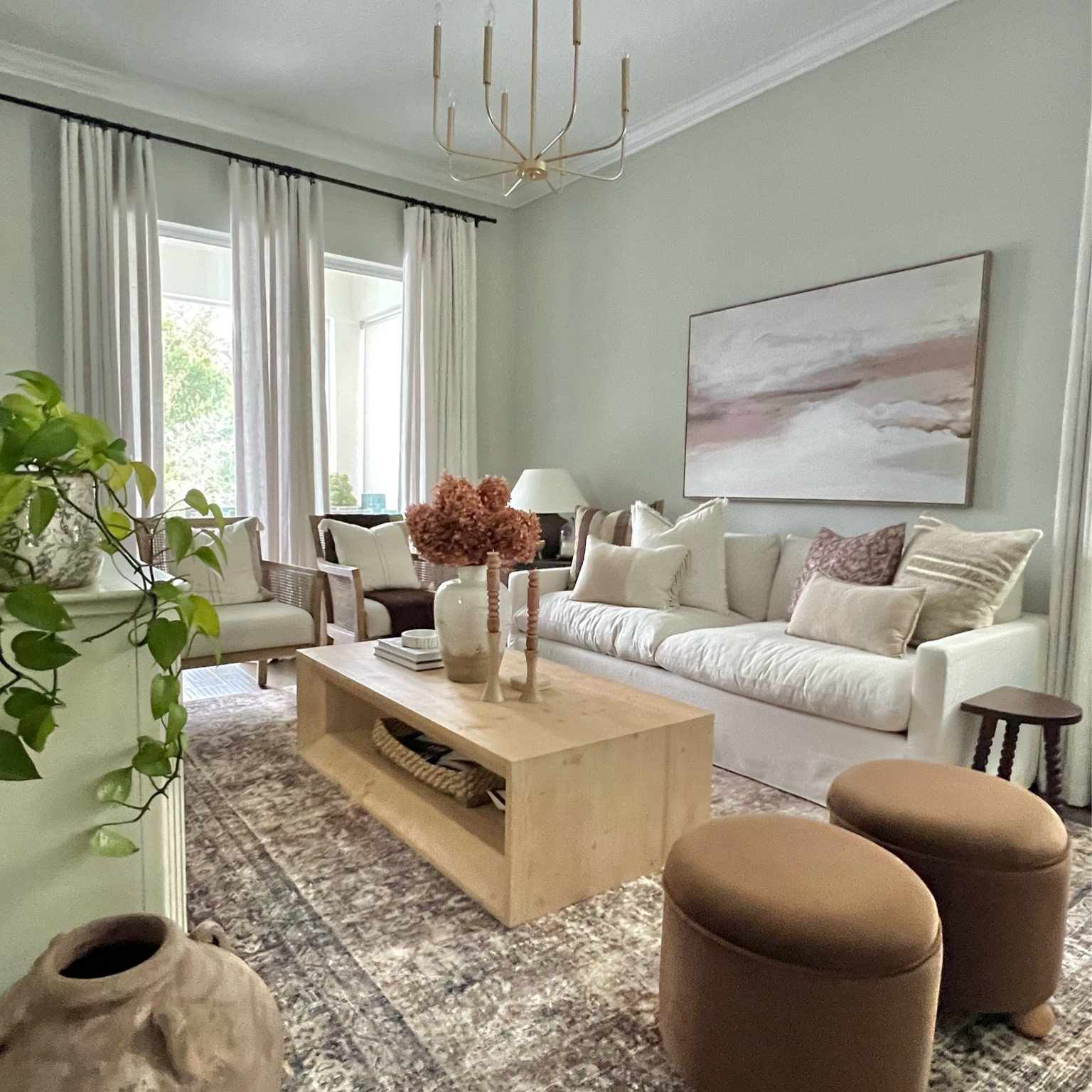 Sitting room decor after the holidays 

Living room
White sofa
Brown ottoman
Cloudpile vintage style Loi Loi rug 
Moody room
Curtains 
White oak large rectangle coffee table 
Came back chair

#LTKsalealert #LTKstyletip #LTKhome