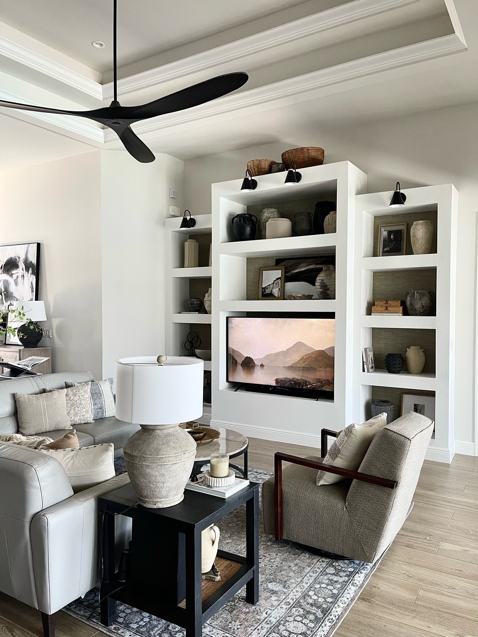 Family Room Decor
Vases, battery operated sconces, print art, family room rug, swivel rocking chair, large table lamp, large black ceiling fan, decor, home decor #boutiquerugs #amazonhome #ballarddesigns #collectionprints #target

#LTKhome #LTKFind #LTKSeasonal