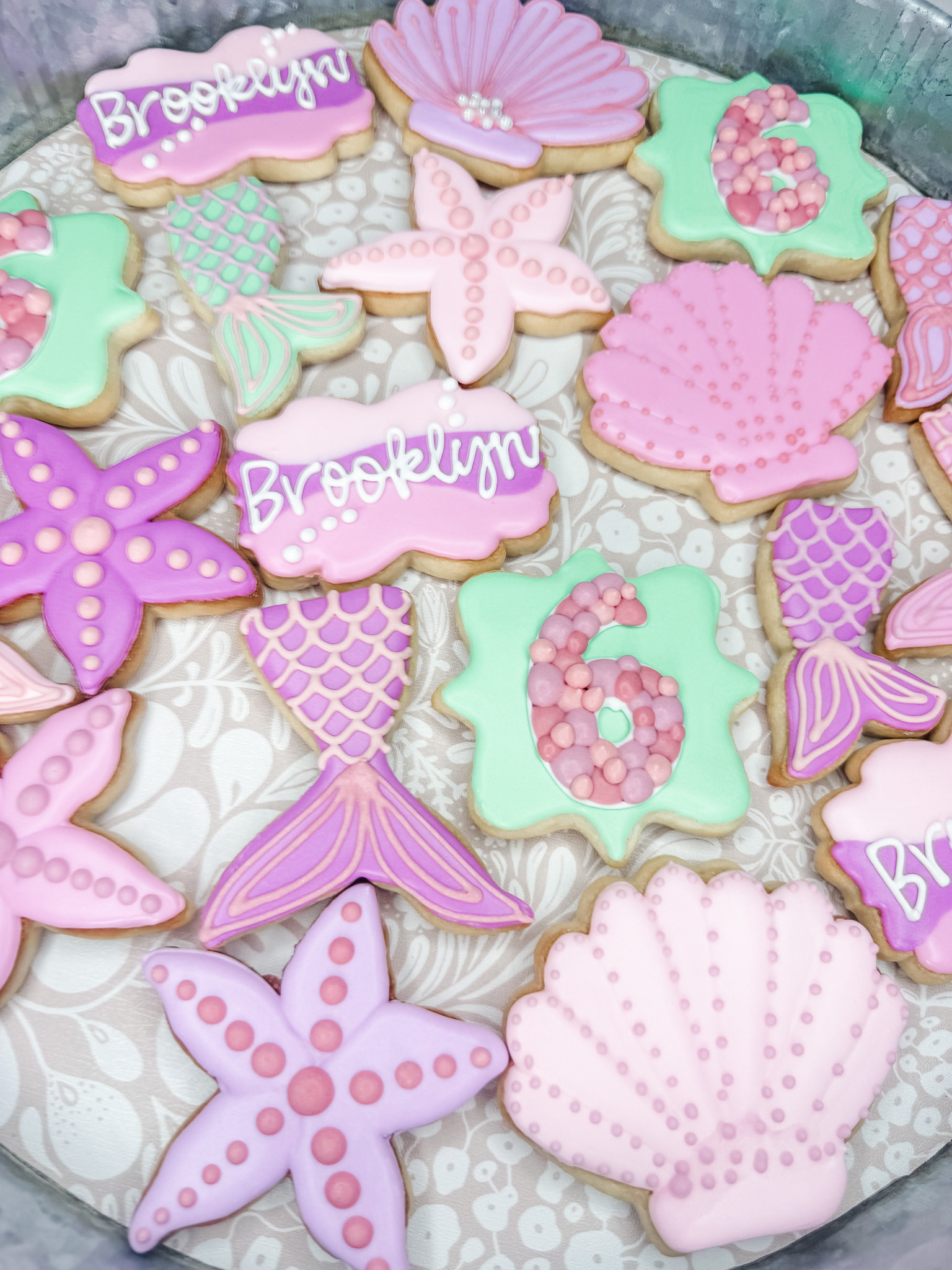This mermaid cookie set is giving all the pastel under-the-sea birthday vibes. 🧜‍♀️ From seashells and starfish to mermaid tails, pearl details, and personalized name cookies, this set was such a fun way to bring a 6th birthday theme to life. Perfect for a dessert table, party favors, or a sweet custom treat for a little mermaid-loving birthday girl.

#LTKFamily #LTKKids #BirthdayCookies #MermaidBirthday #MermaidParty #UnderTheSeaParty #CustomCookies #SugarCookies #DecoratedCookies #CookieDecorating #BirthdayPartyIdeas #GirlsBirthdayParty #DessertTable #PartyInspo #KidsBirthdayParty 

 #LTKdayinmylife #LTKfoodie #LTKKids