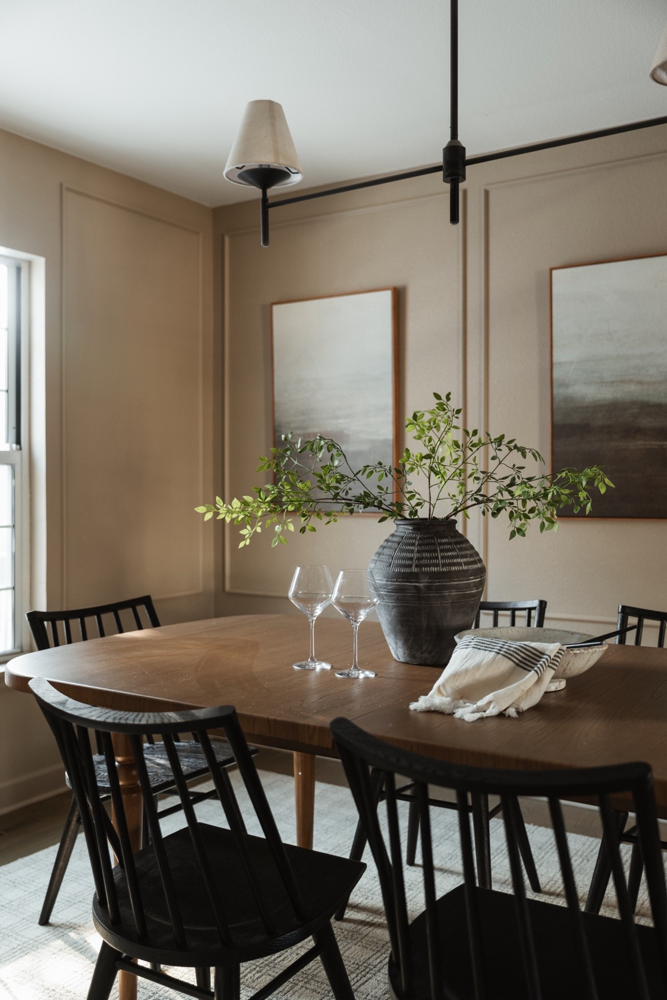 A timeless dining setup with a warm wood table, black dining chairs, and affordable Amazon art. 

Affordable art, designer look, dining room

#LTKHome