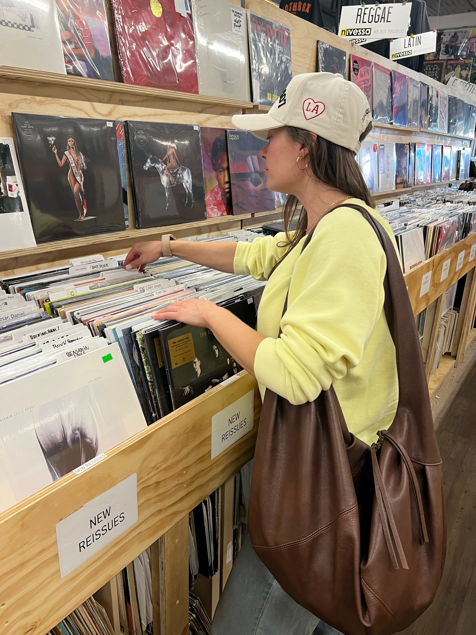 Hunting for records is my new favorite weekend hobby 😊 

I’m wearing a size small in the yellow sweater from Target, the pants are from Cider but I linked something comparable (size small) and the chocolate bag is one size from Free People (obsessed!). I paired this fit with dainty gold jewelry and my favorite Good Quality Human corduroy Los Angeles hat. 

#LTKSaleAlert #LTKFindsUnder50 #LTKStyleTip