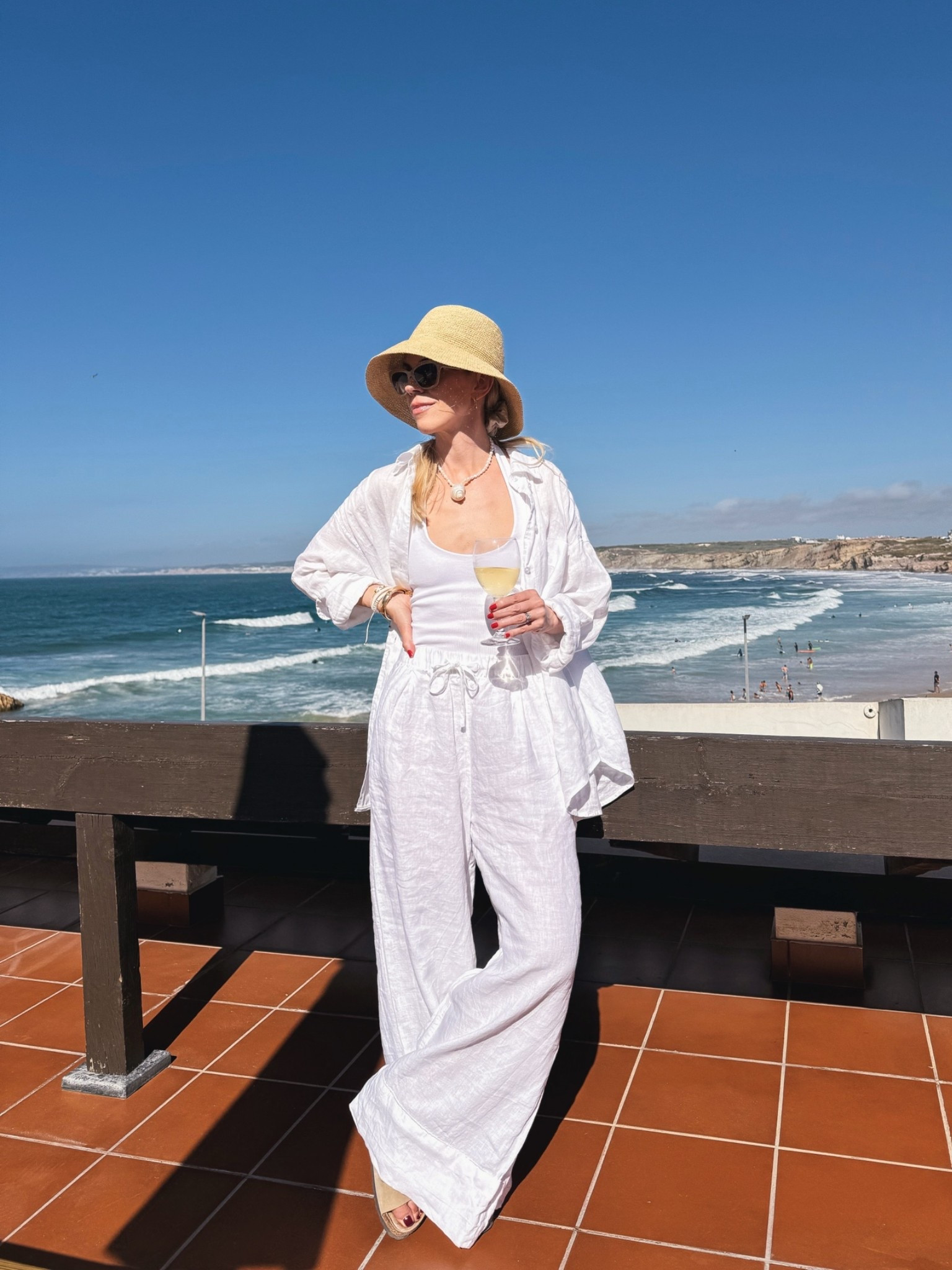 Summer vacation outfit, beach outfit, all white linen pants outfit, @Janessa Leone straw bucket hat, @Zara white linen pants, coastal chic