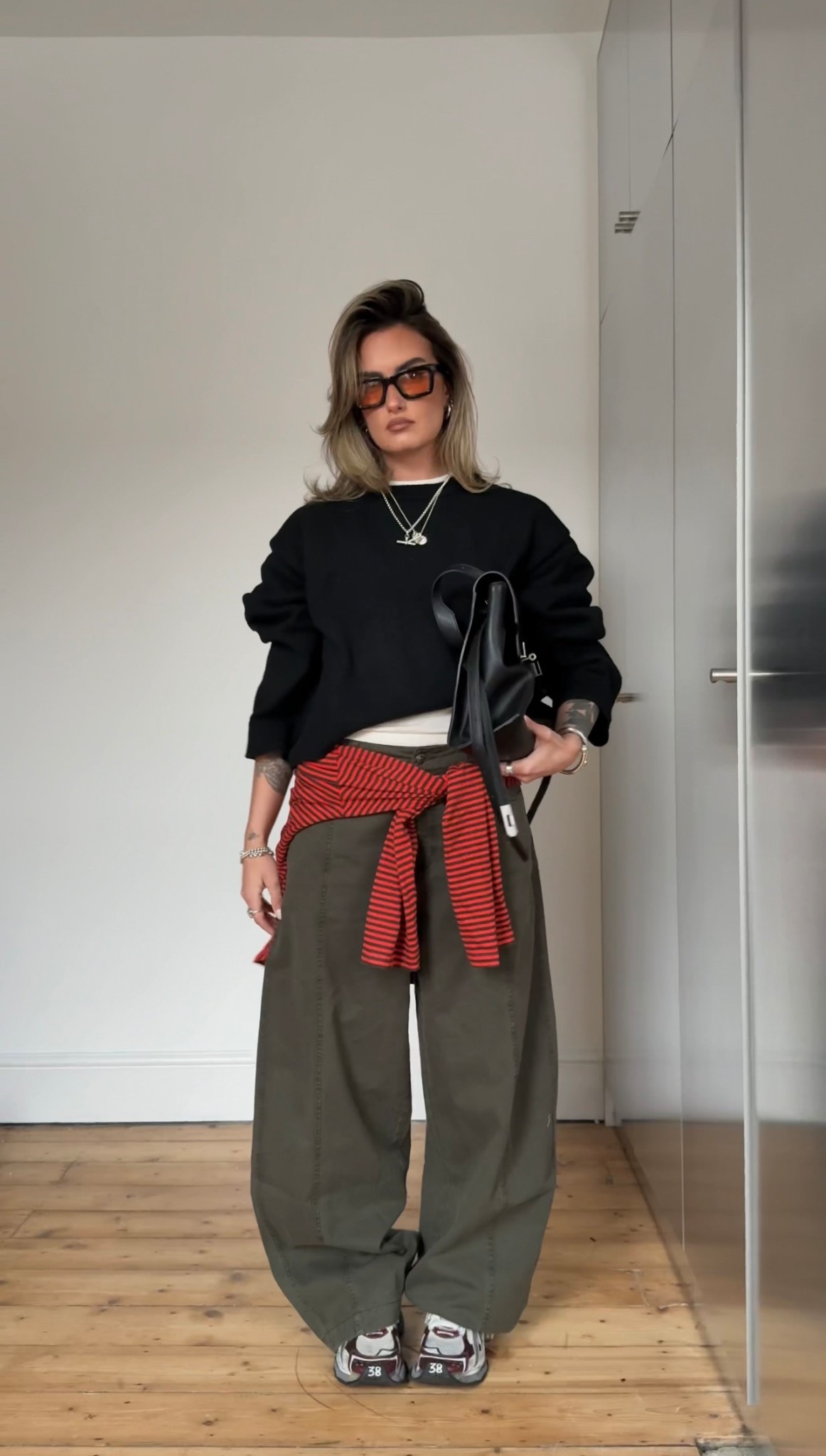 Black jumper, barrel leg, khaki trousers, @asos 

#LTKuk #LTKwinter #LTKeurope