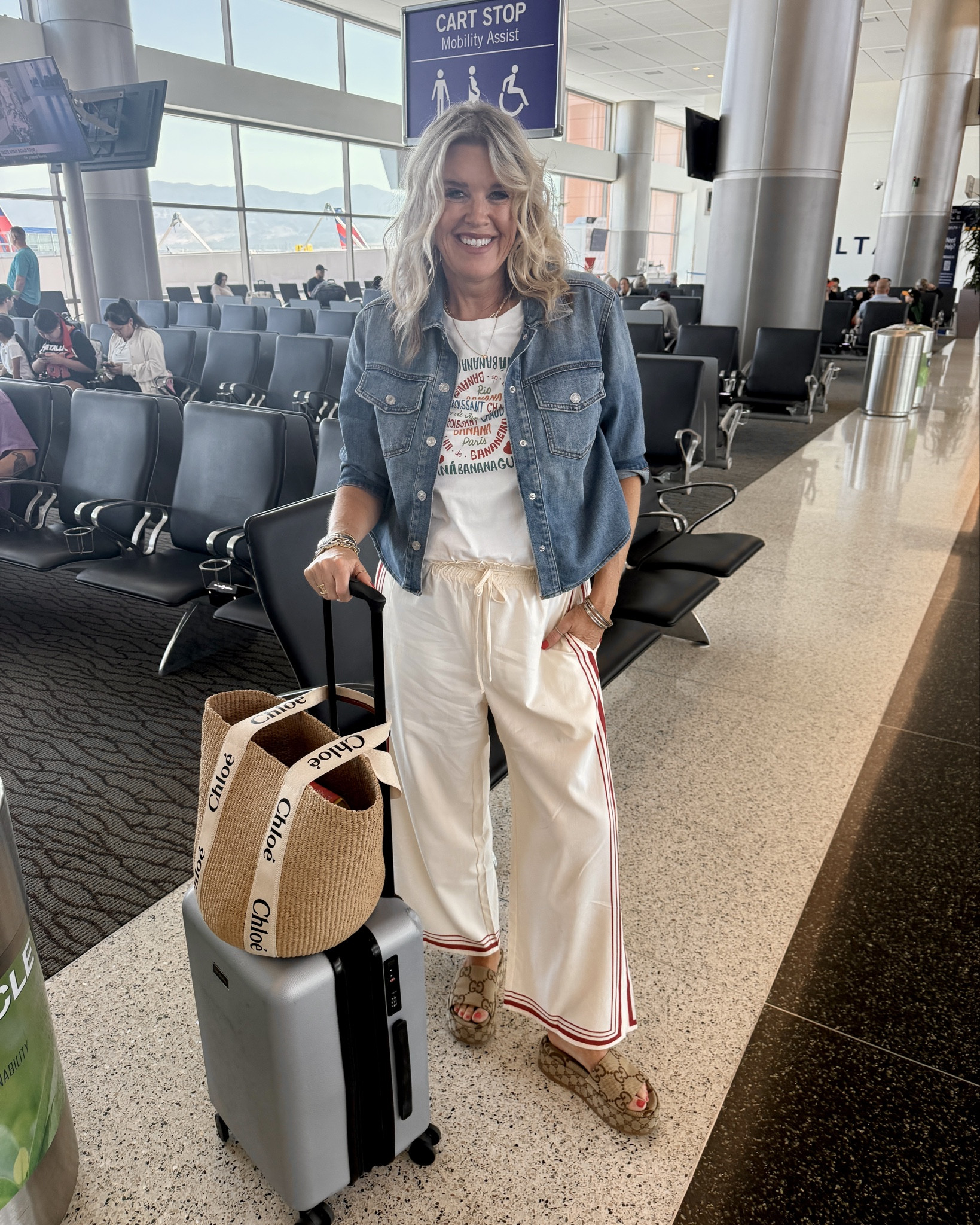 Travel outfit✈️

Mixing Amazon finds with designer🧳

Amazon find 
Graphics Tee shirt with cute sayings fits tts in a small 

and the cutest 
Drawstring$ elastic band wide leg pants with side slits and red stripes. Tts in a med 

Paired with  denim shirt jacket by Chicos tts in a sm 

Chloe straw bag tote perfect for travel and beach 

Gucci platform sandals fit tts, 

Vera Bradley luggage 

Jewelry by 
Tiffany and co
Tag hauer watch 
Cartier 
Some abbot Lyon  & Julie Vos 



#LTKTravel #LTKStyleTip #LTKFindsUnder50