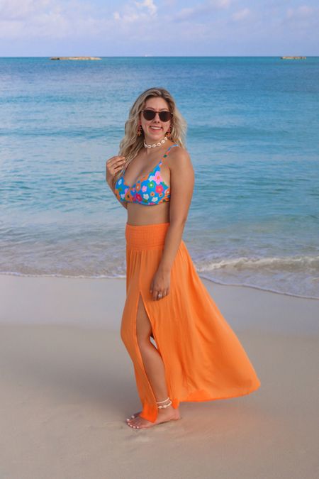 Blue floral bikini with matching orange swim cover up skirt, matching shell necklace and anklets

#LTKswim #LTKtravel #LTKunder50