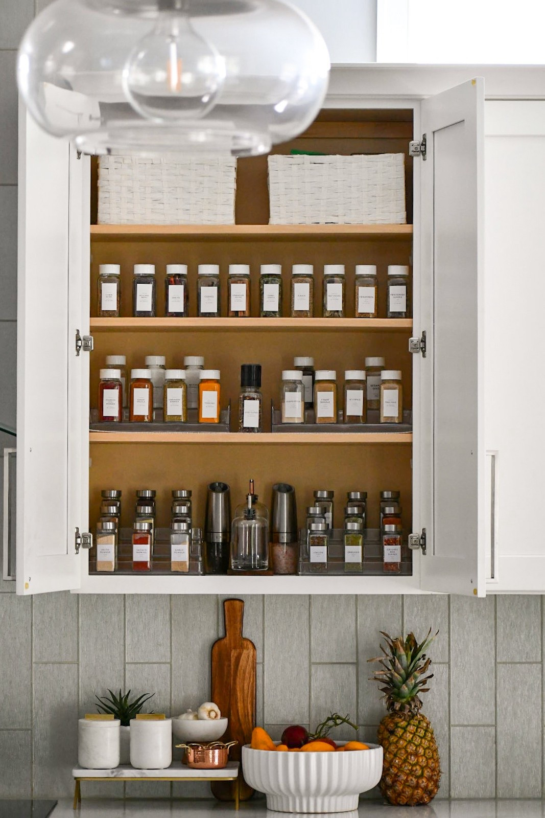 Spice cabinet links 
Top shelf spice bottles with white lids 
Bottom shelf with stainless steel lids 
#spicedrawer #spicecabinet #organization 