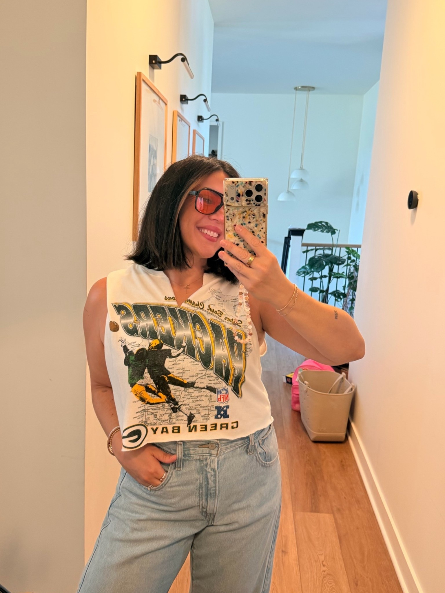 NFL gear! Packer shirt. I did a size small and cut the bottom off and made a v cut.

#LTKmomlife #LTKCon #LTKKids