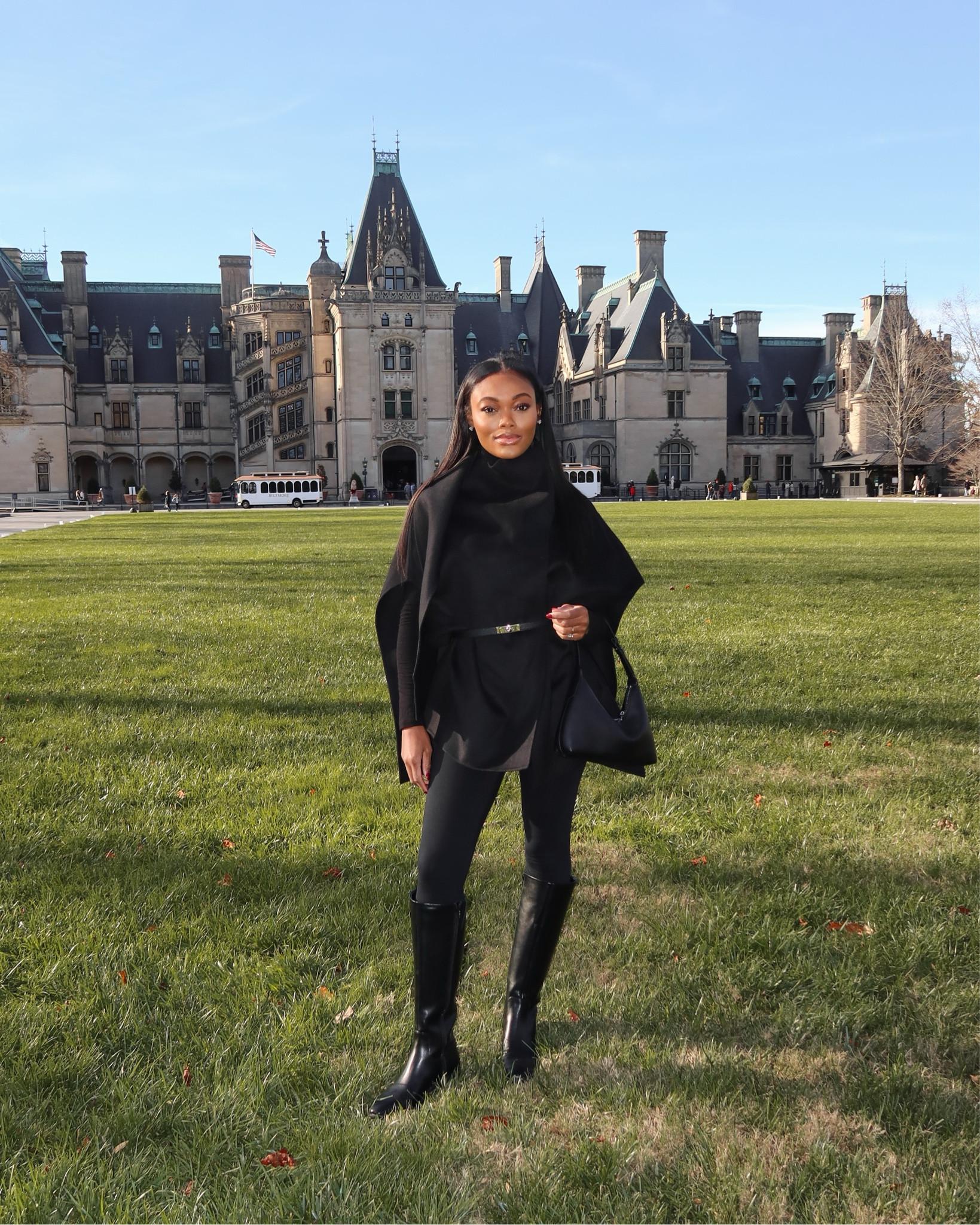 Outfit of the day! I wore this in Asheville for an afternoon at the Biltmore Estate. I love this black cape paired with leggings and knee-high boots! 🖤 

#LTKSeasonal #LTKHoliday #LTKWatchNow