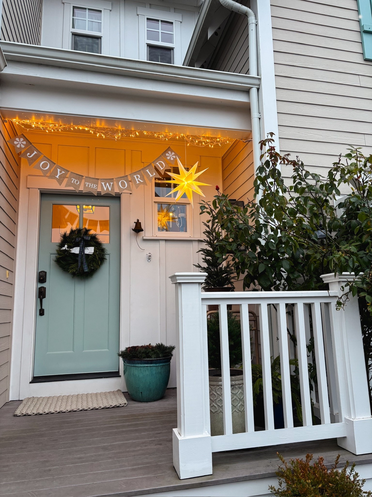 Simple Christmas porch - joy to world banner, lit Moravian stars, metal whale wreath, doormat 

#LTKSaleAlert #LTKHome #LTKHoliday