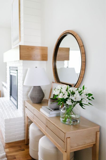 A pretty console table, ottomans & table lamp all from Target!!

Living room
Console table
Table lamp
Ottoman 
Target home
Round mirror 

#LTKunder100 #LTKhome #LTKSeasonal