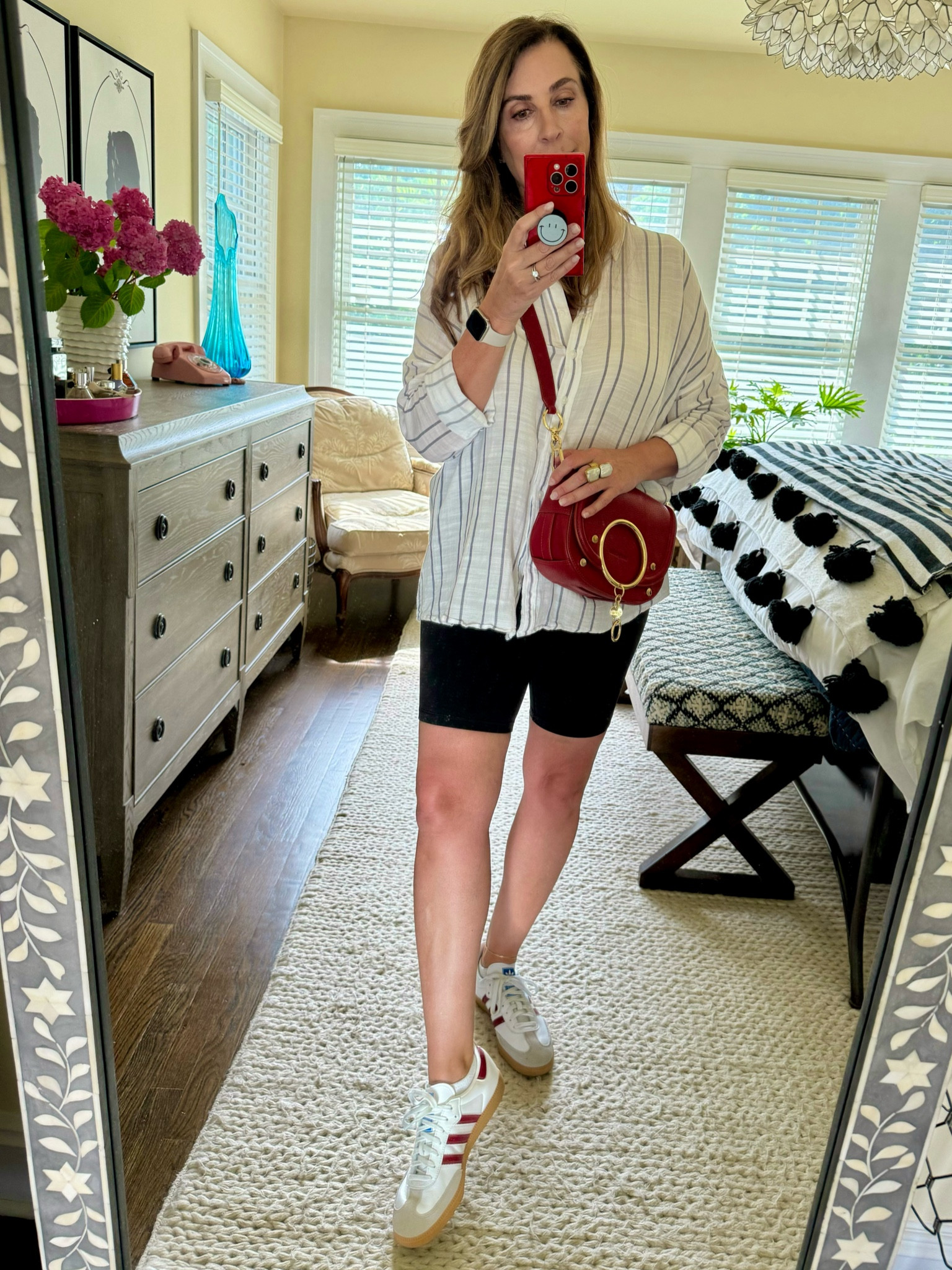 ❤️ SALE ALERT! ❤️
Ladies … DON’T BE AFRIAD OF BIKE SHORTS! This is the perfect travel outfit! My thighs are not my greatest asset but a good pair of bike shorts will suck you in in all the right places! 
These get glowing reviews and I love the 8” inseam and under $30. 
Paired with a billowy button down shirt (less than $20 on clearance now - runs large I sized down to a medium!), my favorite new sneakers that keep me on trend and a fun pop of color red crossbody bag and I’m all set for errands.
PS my bag is on MAJOR SALE at almost half off! 

#LTKSaleAlert #LTKMidsize #LTKOver40