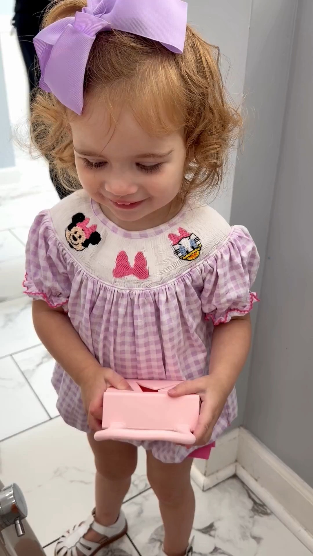 Caroline & Her Snack Purse 🎀

Tiny purse, big personality! 💕 Caroline is officially obsessed with her adorable snack purse, and I have to admit… it’s one of the cutest toddler finds. Perfect for holding little snacks, tiny treasures, or all the must-haves for a day of adventures. 🍓👜

She’s wearing the sweetest lavender gingham smocked bubble with embroidered mouse-inspired details, paired with classic white fisherman sandals and an oversized lavender bow for the cutest summer outfit. 💜

Everything is linked in my LTK, including her dress, sandals, bow, and the viral toddler snack purse that’s as practical as it is adorable!

toddler summer outfit, toddler girl fashion, lavender gingham bubble, smocked toddler dress, embroidered toddler outfit, oversized hair bow, white fisherman sandals, toddler accessories, snack purse, toddler essentials, Disney-inspired toddler outfit, cute toddler style, summer kids fashion, girls boutique clothing, LTK kids fashion

#LTKKids #LTKBaby #LTKTravel