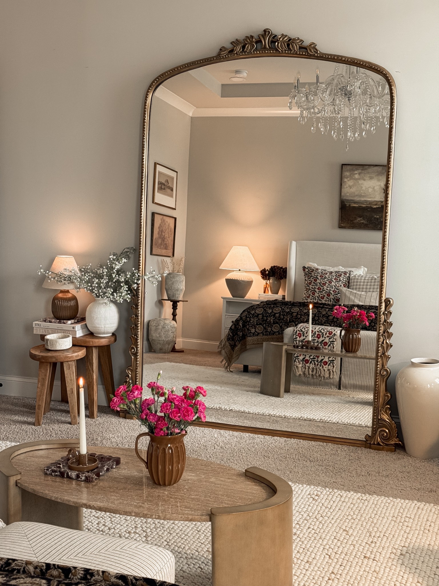 Primary bedroom 

Anthropologie Floor Mirror, Target wooden table, Travertine oval coffee table, Candle stand, floor vase, coffee table book, white bed, nightstand, zgallerie chandelier 

#LTKStyleTip #LTKHome