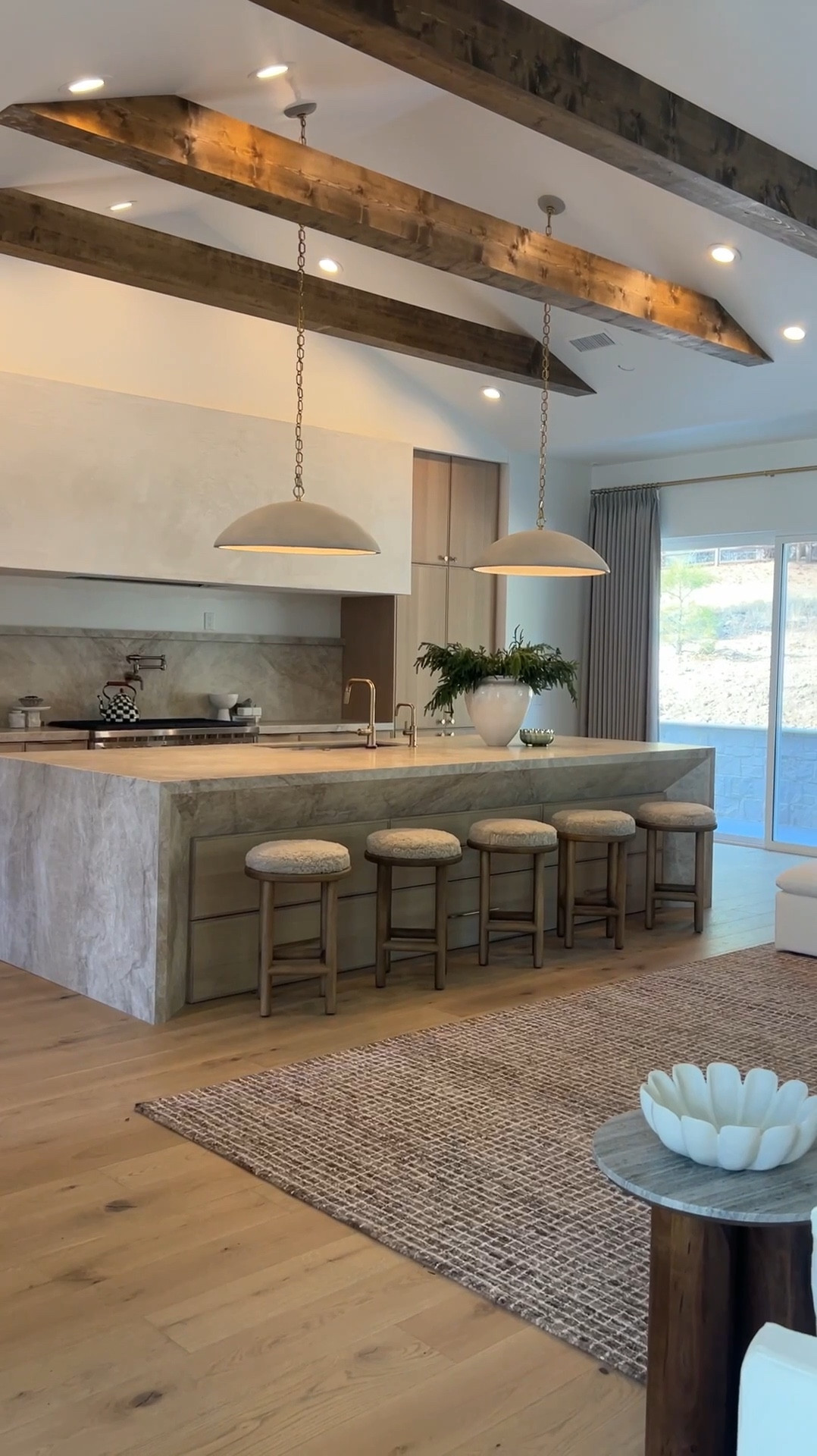 📣 FINALLY- Full kitchen reveal of our Flagstaff Home. This audio pretty much sums it up for me 🤌🏼 I am not a rule follower, I make design choices that truly excites me (as you can see, I had Jeff build me a 12' custom range hood 🤭). I envisioned a kitchen like this for a very long time 😍 Couldn't be happier with the outcome. 

Can we also talk about these gorgeous pendants from @Lightopia?!? They definitely elevated the look of this space don't you think?!. I have been eyeing these 30" beauties for quite sometime now. They also come in different sizes as well to accommodate different island sizes. Head to story to see a close up. #kitcheninspo #pendantlights #kitcheninspiration #TajMahal

#LTKHome