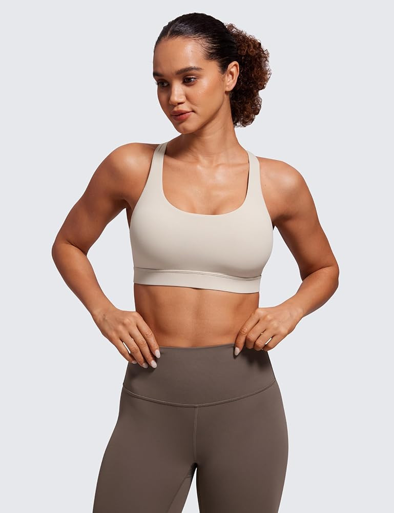 CRZ YOGA Women's Strappy Sports Bras Fitness Workout Padded Yoga Top Criss Cross Back Cami | Amazon (US)