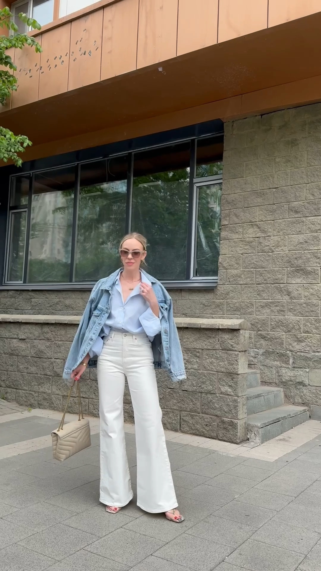 Spring outfit 2026, white flare jeans, blue button down shirt outfit, snakeskin print sandals 

#LTKOver40 #LTKSaleAlert #LTKSeasonal