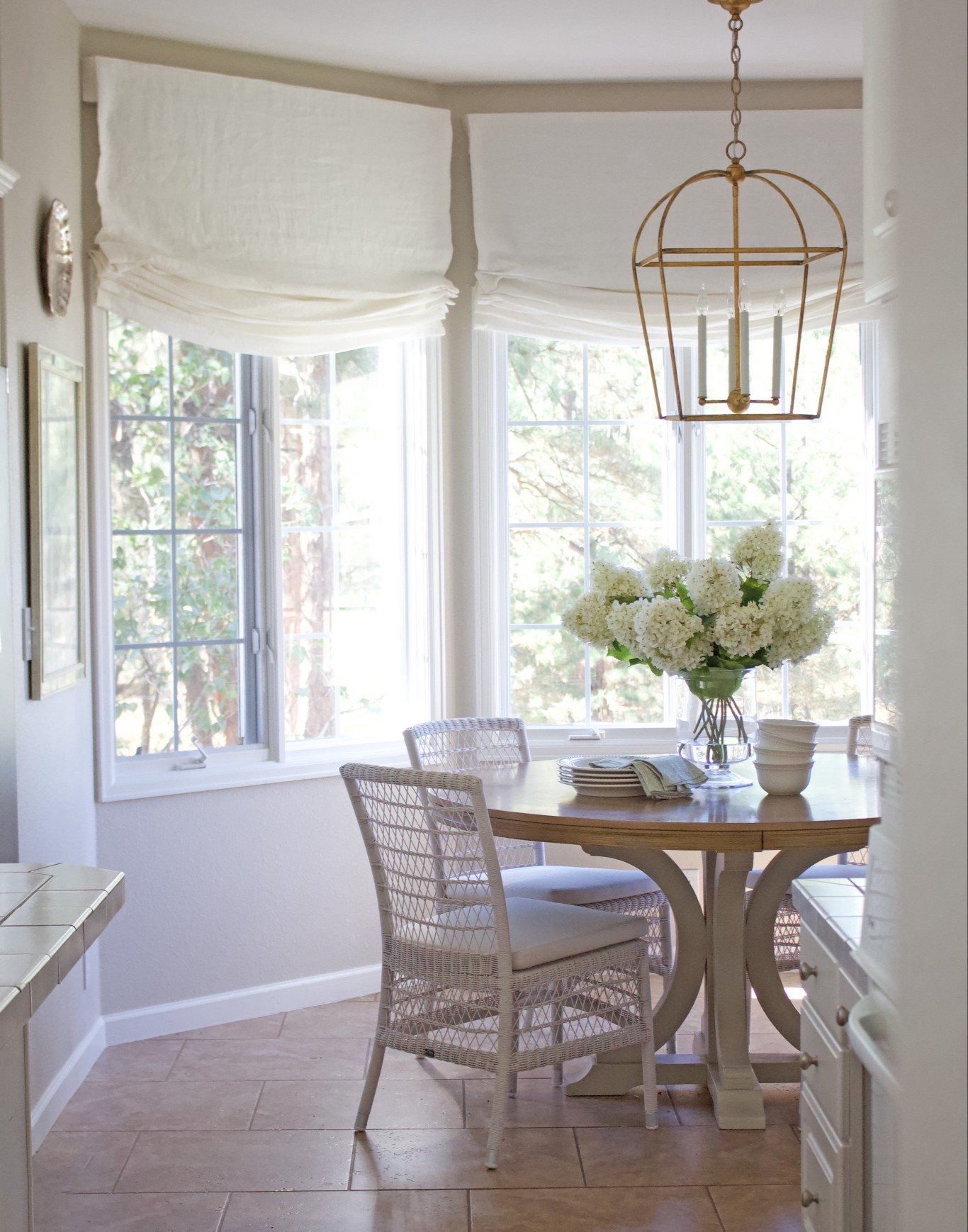 I love the view outside our breakfast nook and wanted window treatments that wouldn’t take away from the view, but also bring some style to the space. These relaxed roman shades in linen from @twopages did all that and more! By hanging them 1.5 feet higher than the window frame, it highlights the tall ceilings and makes the space feel more grand, don’t you think?? 

#LTKStyleTip #LTKHome