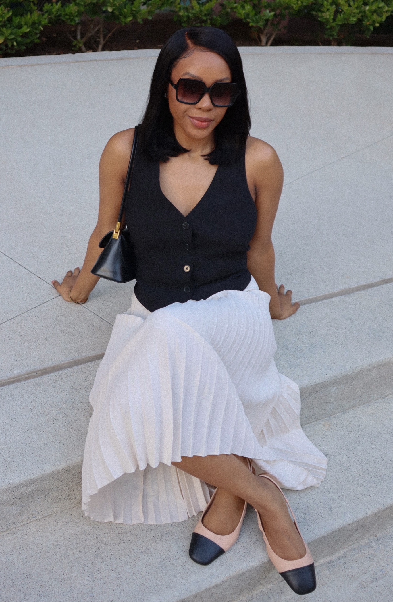 Black and cream outfit inspo 🖤🤍 I love this pleated cream skirt from H&M it’s perfect for spring time. I paired it with a black v-neck vest from Express.

#LTKstyletip #LTKworkwear #LTKSeasonal