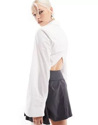 ASOS DESIGN cropped shoulder pad shirt with open back | ASOS (Global)