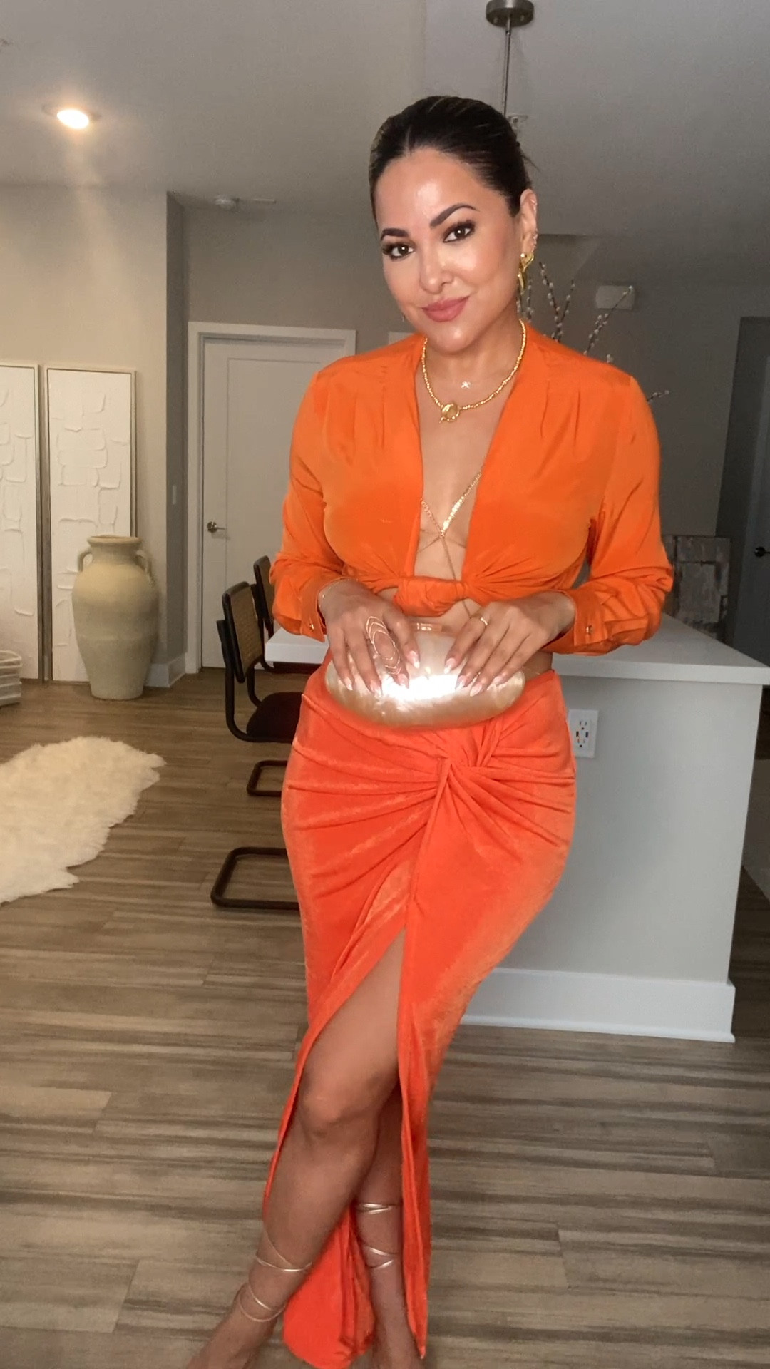 GRWM: An All Orange Look 🍊

For a more modest look, style the skirt with an orange racer back bodysuit instead — added some to alternatives xo 

Outfit Breakdown:
skirt — @jluxlabel “Orange Kimora slinky skirt"
top — @motf_official 
bag — @amazonfashion 
body chain — @revolve@x @camilacoelhocollection 
earrings + nevklace@— @aureum.collective 
shoes — @rayethelabel 
fragrance — @yslbeauty