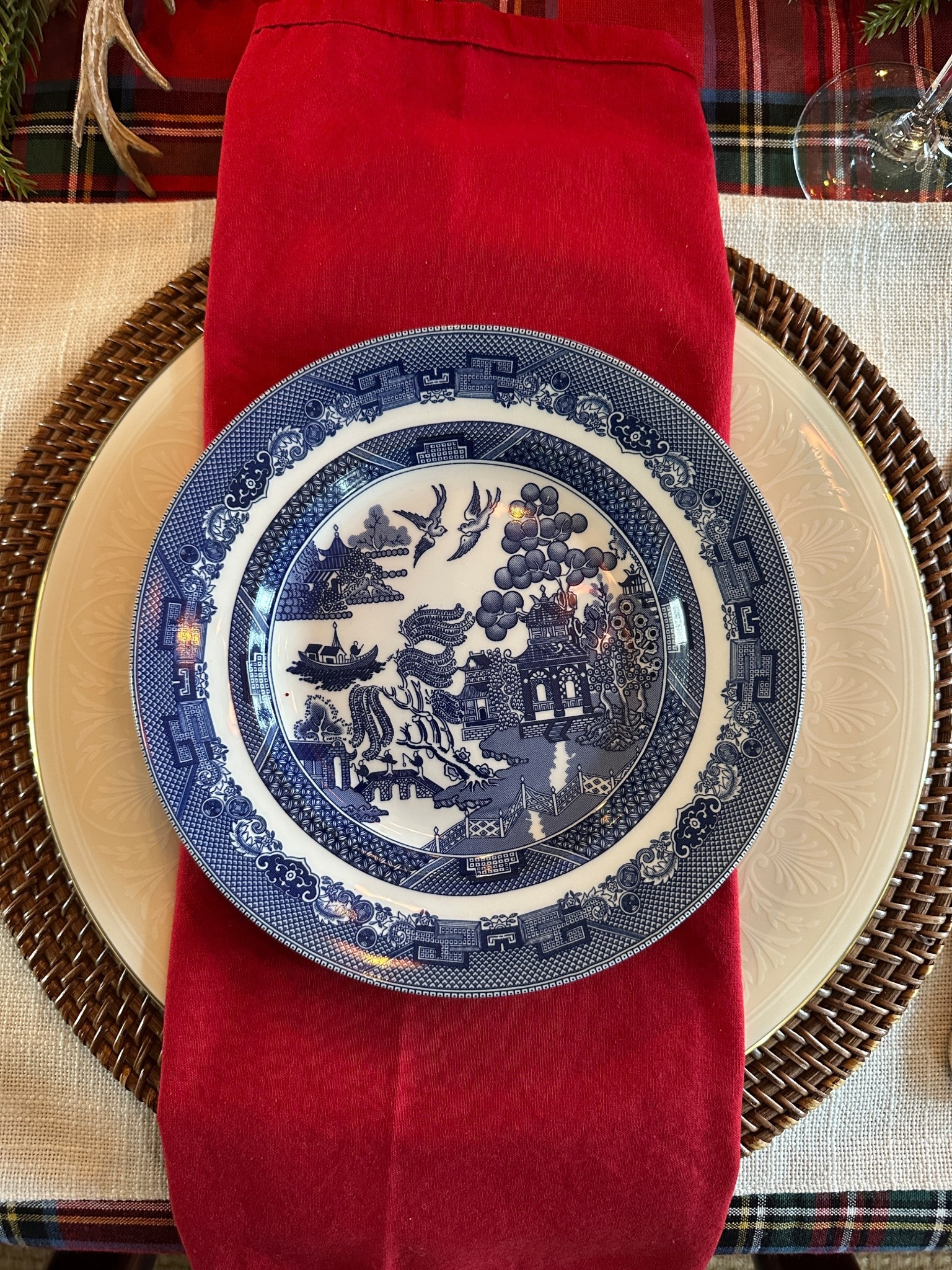 Classic Christmas place setting with red napkins, Lenox china and blue willow dishes. 

#LTKSeasonal #LTKHome #LTKHoliday