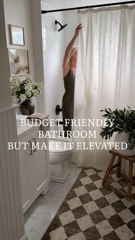 Affordable bathroom decor, neutral bathroom, vanity, shower curtain, runner, spring florals, arched mirror, shelf decor 

#LTKVideo #LTKStyleTip #LTKHome