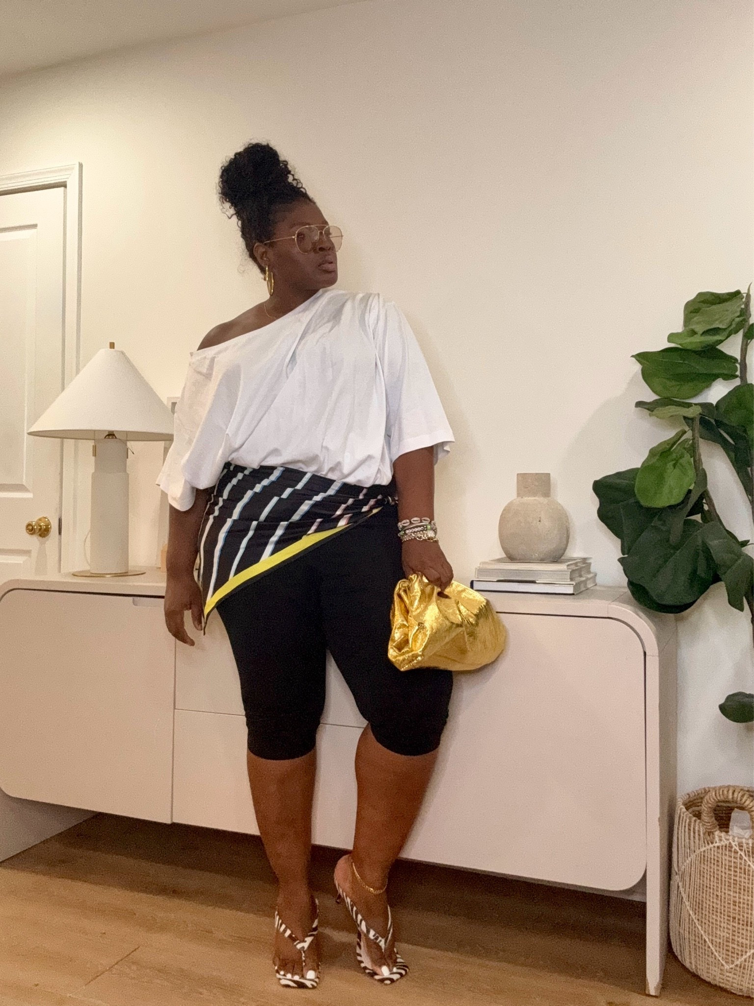 Comfort was the goal, but style wasn't optional. This look blends relaxed basics with eye-catching accessories for an outfit that feels effortless from day to night. leggings outfit, black and white outfit, casual chic outfit, summer outfit ideas, elevated casual style, statement accessories, weekend outfit, brunch outfit, vacation outfit, everyday fashion

#LTKootd #LTKSeasonal #LTKMidsize