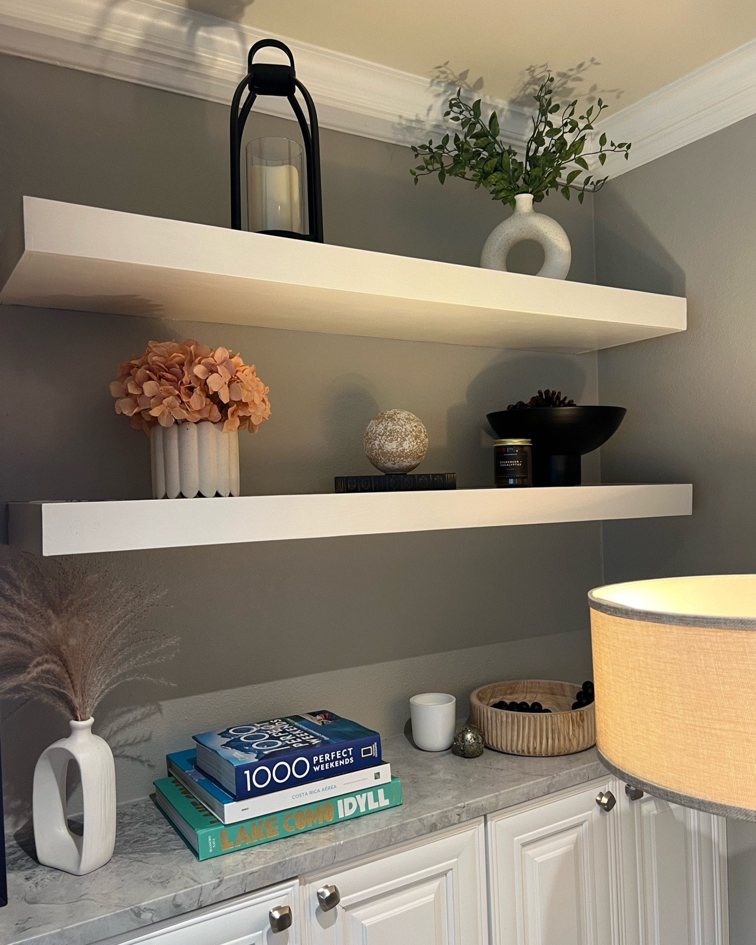 Living room reset! Found some pretty decor to fill our empty shelves after taking Christmas stuff down! Linked some similar modern & boho decor ideas 💡 🛋️🖼️ 🌸🕯️ 

#LTKSeasonal #LTKHome #LTKStyleTip