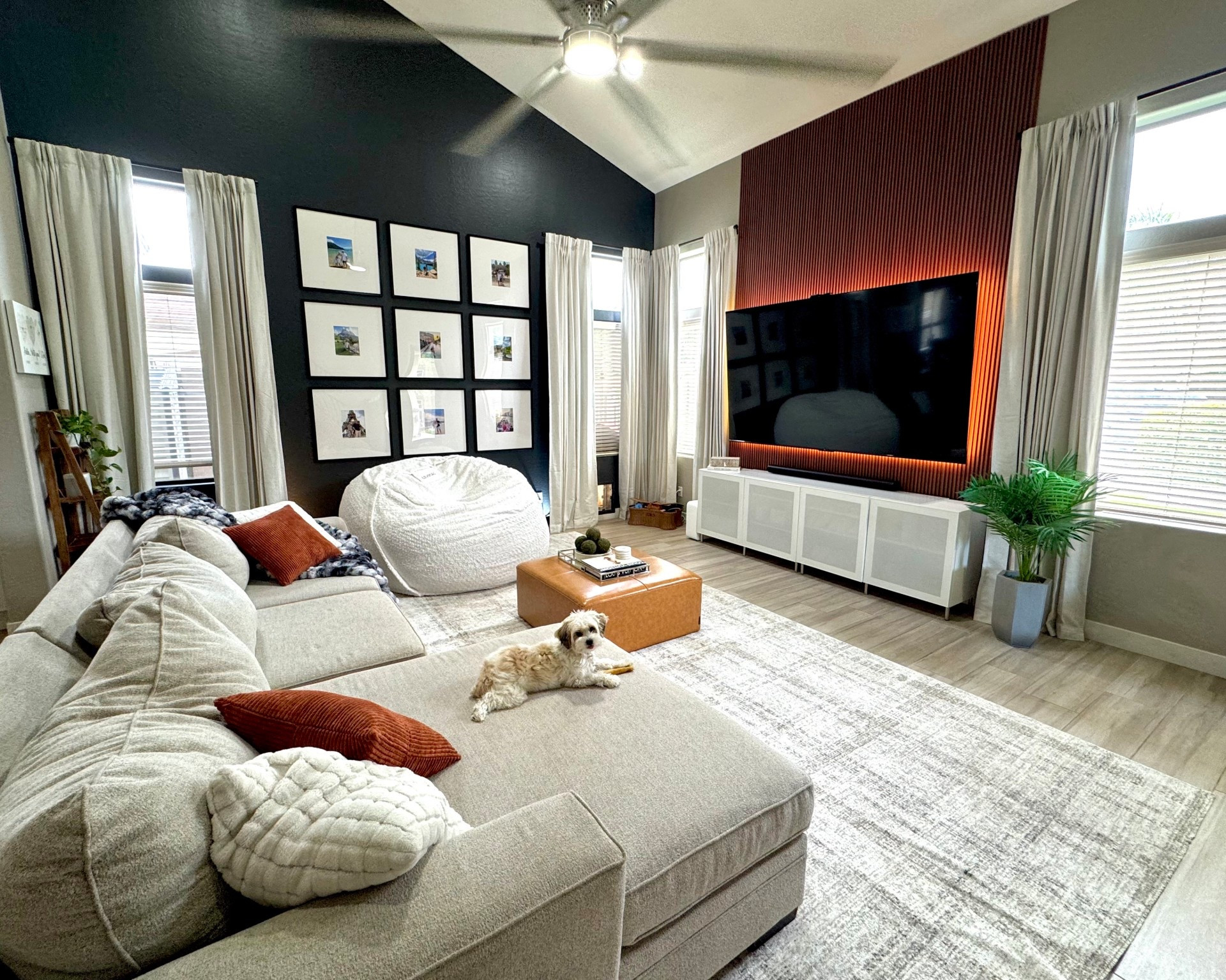 Living room decor. I love the wall panels and the new rug. Wall pictures and curtains made a difference! 

#LTKHome #LTKFamily #LTKStyleTip