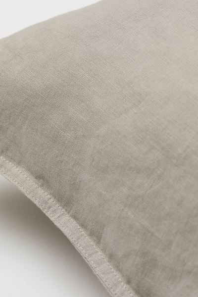 Premium Quality
	Pillowcase in washed linen with double-stitched edges and a thread count of 104.... | H&M (UK, MY, IN, SG, PH, TW, HK)