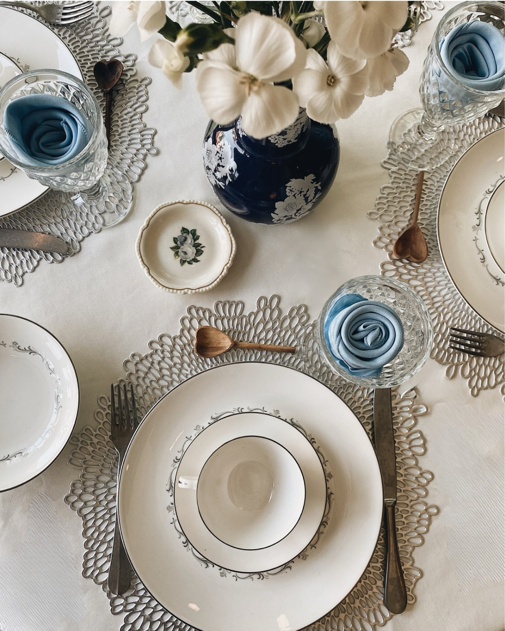 Elegant blue and white tablescape - vintage pieces mixed with new. 
Tablecloth | cloth napkin | vintage bone china | glassware | goblets | silverware | Italian flatware | placemats

#LTKFindsUnder100 #LTKHome #LTKFindsUnder50