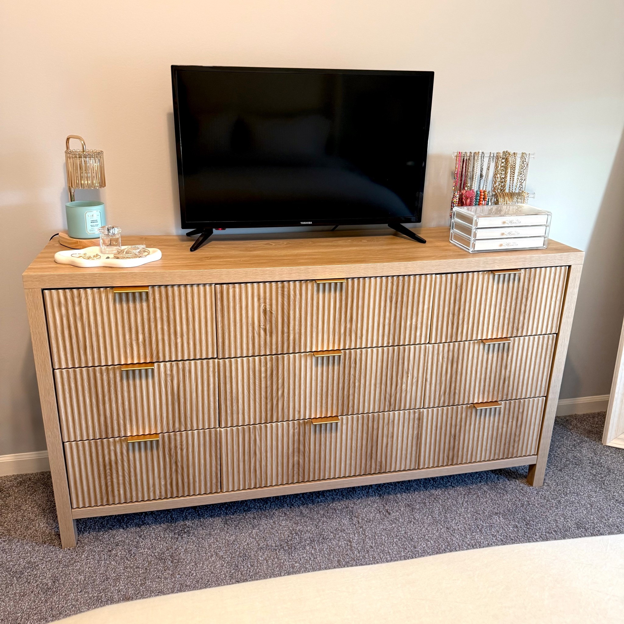 My 9 drawer fluted dresser is on sale - clip the $50 off coupon before checkout! It’s beautiful, sturdy and holds a ton of clothes. Comes in 3 colors - I have the natural.  Easily one of my favorite things I’ve purchased for my home 🤍

#dresser #9drawerdresser #fluteddresser #sale #homedecor #bedroomdecor #bedroomfurniture #candlewarmer #jewelryorganizer #giftideas 

#LTKHome #LTKSaleAlert